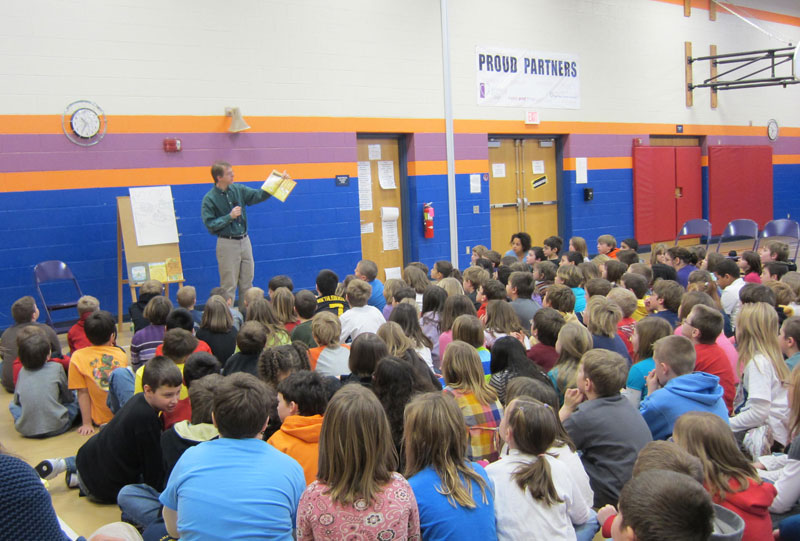 John Lechner speaking at an elementary school